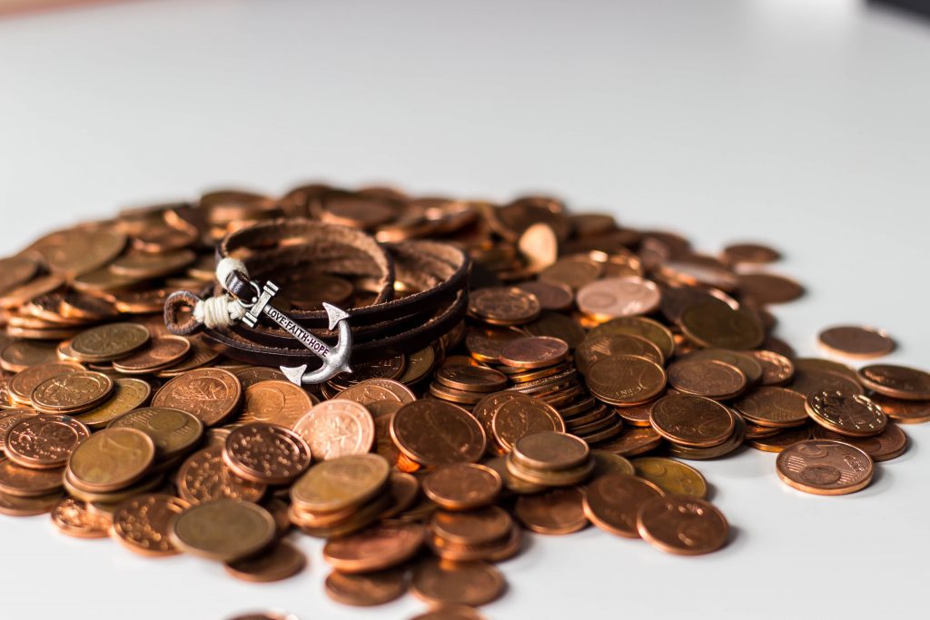 Photo of coins with Anchor by Jonathan Brinkhorst on Unsplash